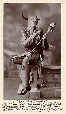 A court jester, carrying a marotte, selected for the Pageant of Empire in 1909