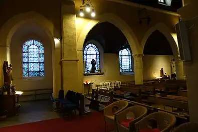 Collateral aisle and stained glass