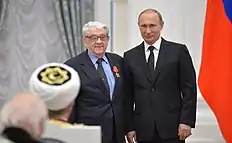 Photograph of Valentin Zorin receiving the Order of Alexander Nevsky from Vladimir Putin in 2015.