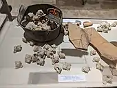 Murex shells from the Iron Age II period (10th–7th centuries BCE) with ancient remains of purple on the shards seen on the rights