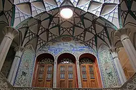 Wooden windows and wall carvings at the Borujerdi House.