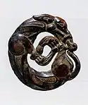 Harness ornament in the shape of a coiled wolf, characteristic of nomadic artifacts of southern Ningxia and southeastern Gansu, 5th-4th century BC.