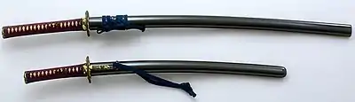 Two antique koshirae, katana (top), wakizashi (bottom), in the form of a daishō (matched set). Edo period, 19th century. Tokyo Fuji Art Museum.