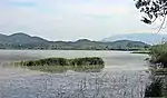 Wetland with lake and some mountains in the background