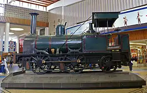 Here in the midst of Cape Town in the modern railway station building stands a monument which calls our attention for a moment from the romantic past, epitomised in the Castle and Parade, to the realities of the age of the machine : an old railway engine. Type of site: Locomotive.