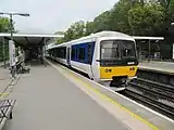 A suburban diesel toward Marylebone along the western platform.