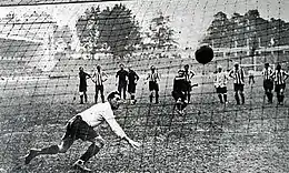 A successful penalty kick, seen from the back of the net