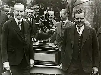 President Calvin Coolidge congratulated Charles Lawrance for his development of air-cooled aircraft radial engine that won the 1927 Collier Trophy for the year's greatest achievement in American aviation.