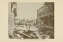 An image showing damage and flooding in a downtown setting