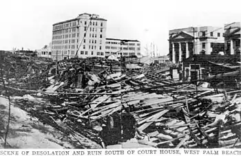 An image with storm debris piled high above ground