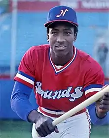 A baseball player in red and white