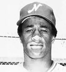 A black and white photograph of a baseball player