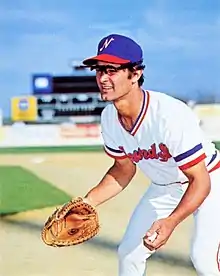 A baseball player in white