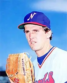 A baseball player in red, white, and blue