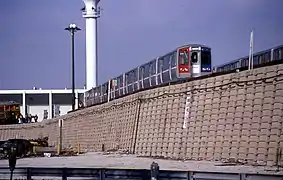 A Green Line train sits in the Harlem Yard