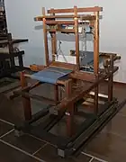 Narrow tanmono loom with an obvious shuttle race on a top-mounted beater bar. Late 18-hundreds Japan.