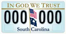 "In God We Trust" on the top of the optional license plate of South Carolina, designed in 2002. U.S. and South Carolina's flag appear weaving off a pole in the middle, separating two series of three characters each.