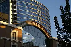 The tinted blue glass curtain walls of The Regent in the background