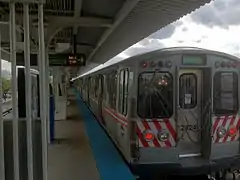 A Green Line train sits at the Harlem/Lake terminal