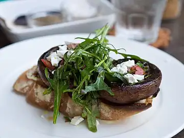 Grilled portobello, feta, and arugula salad on toasted baguette