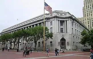 Photograph of the Federal Office Building, an imposing, five-story, stone building in an urban setting