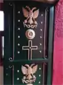 Door of Panayia Yiatrissa's main chapel, displaying Orthodox (Byzantine) double-headed eagle and serpents.