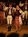 Romanians from Cluj-Napoca, Cluj County, Transylvania, Romania, in traditional folk costumes, dancing on the occasion of the Mărțișor holiday (2006).