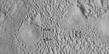 Brain terrain being formed, as seen by HiRISE under HiWish program Note: this is an enlargement of the previous image using HiView.  Arrows indicate spots where brain terrain is beginning to form.