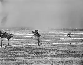 The British 46th (North Midland) Division attacking the Hohenzollern Redoubt during the Battle of Loos. A cloud of smoke and gas appears in the centre and left. 13 October 1915