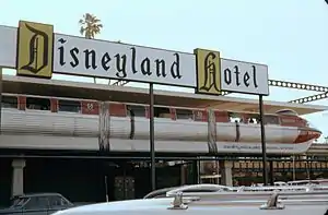 The original red Mark I ALWEG Monorail train, with one car added, then designated Mark II. Both trains were specially created for Disneyland. The other train was blue but otherwise identical. Seen at the Disneyland Hotel station in August 1963.