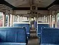 The interior of the mid 1980s refurbished Standard Class accommodation, in Network SouthEast moquette, aboard a three car Class 117 DMU.