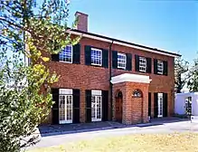 This house clearly expresses the more important features of Georgian architecture. The exterior is undistinguished—a cube-shaped double-storeyed building in which the natural colour of its unplastered and un coloured brick walls is emphasised. It has sash Bertram House, which occupies an important place in the history of South African architecture, is one of several buildings erected within the original confines of the Dutch East India Company’s garden. It is partly hidden by a high wall near the top of th Type of site: House Previous use: Residential. Current use: Museum. Bertram House is probably the only surviving example of the brick houses of the English Georgian style. It was built during the first quarter of the nineteenth century.