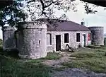 This fortified house is one of the few remaining examples of a series of similar structures which were built during the Frontier War of 1877-1878 to protect the railway line between East London and Toise River.