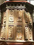 Sculpted wood panels on the pulpit