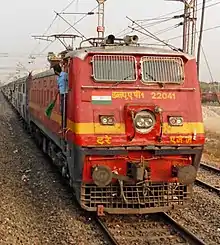 AJJ WAP-1 with WAP-4 livery hauls Trivandrum-bound Guwahati Express