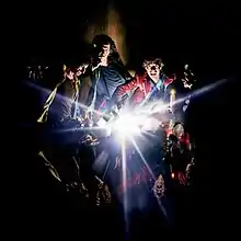 A painting of the band members with an explosion of light in the center