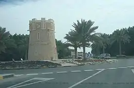 A fort entrance sign to Al Khor Community