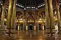 A very well lit Durbar Hall (ceremonial meeting hall of the royal court) of Mysore Palace during day