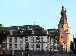 A large white-and-pink brick building