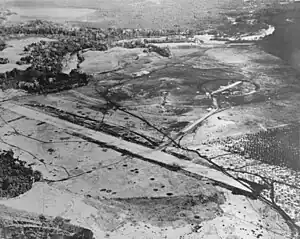 Aerial view of Henderson Field on Guadalcanal, late August 1942. The view looks northwest with the Lunga River and Lunga Point at the top of the image