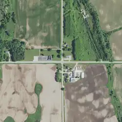 County Trunk Highway OO runs east–west and S. Shiloh Road runs north–south.Schuyler Creek (right) flows southeast