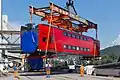 Car being loaded onto a barge for transport, ESh2 Eurasia