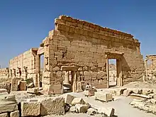 Ruins of two stone walls, with doorways