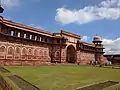 The 16th century Jahangiri Mahal at the Agra Fort has a four-centred arched gateway flanked by four-centred blind arches.