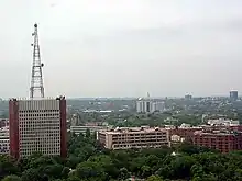 Distant photo of building complex with tower