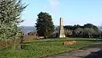 a stone structure in a park