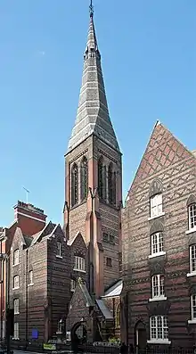 All Saints, Margaret Streetwith church house (7 Margaret Street) and vestry (8 Margaret Street), including railings to basement area and attached pair of lamp standards