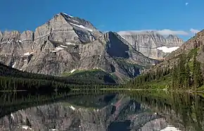 Angel Wing (centered) reflected in Lake Josephine with Mt. Gould (behind, left)