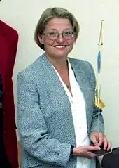 Smiling woman with short hair and glasses