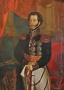 Painted half-length portrait showing a young man with curly hair and mustachios who is wearing an elaborate embroidered military tunic with gold epaulets and medals